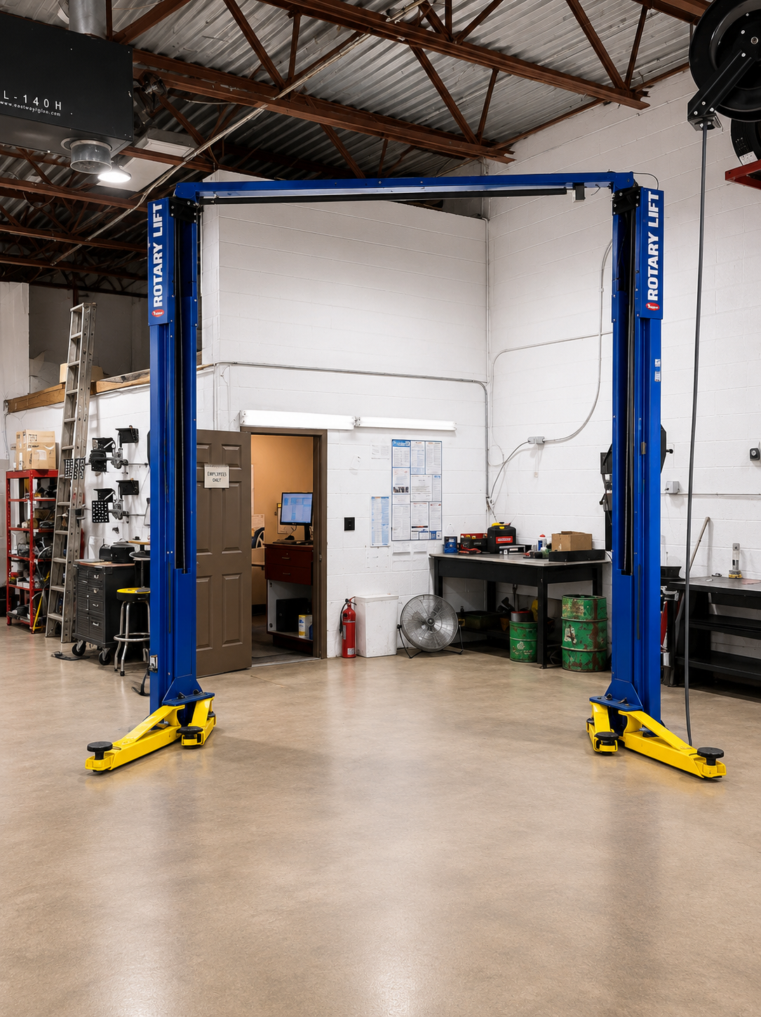 Clean repair bay with two-post lift at Browncroft Auto Service Center, Rochester NY